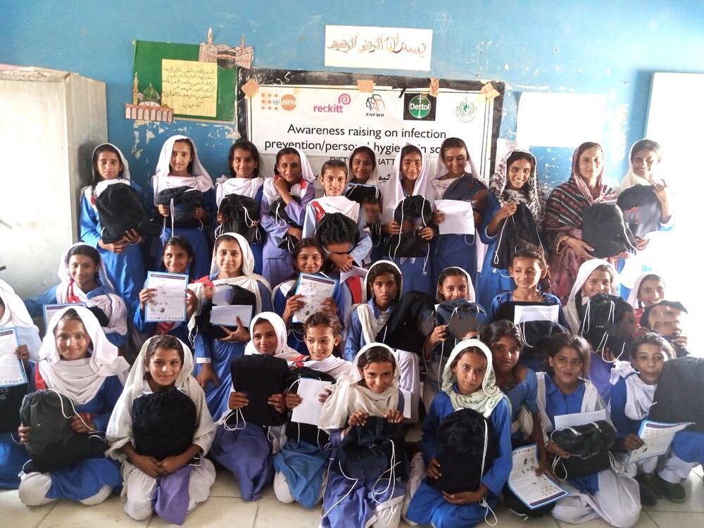 Students at a government school in Thatta, Sindh display their personal hygiene kits and awareness materials after a training session on menstrual hygiene and infection prevention. 