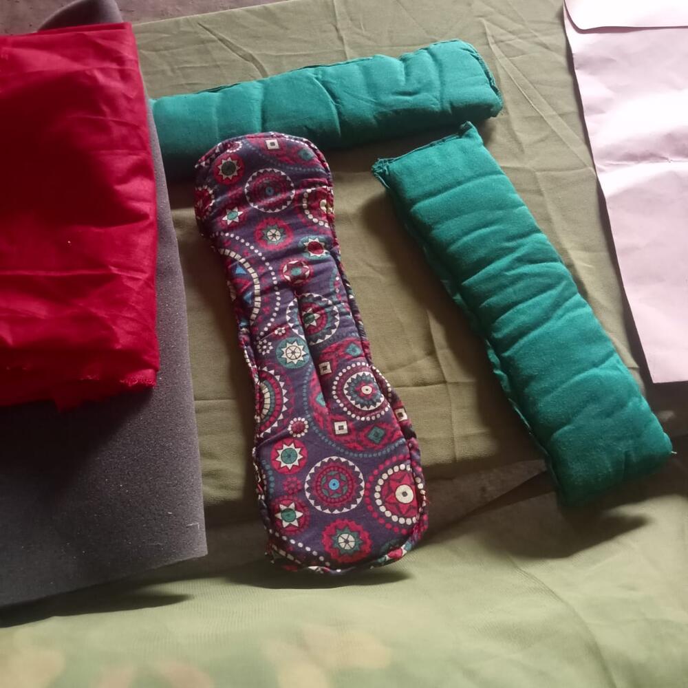 Reusable sanitary pads made by Farah with care and local materials — a sustainable solution empowering women and girls to manage menstrual hygiene with dignity and confidence.