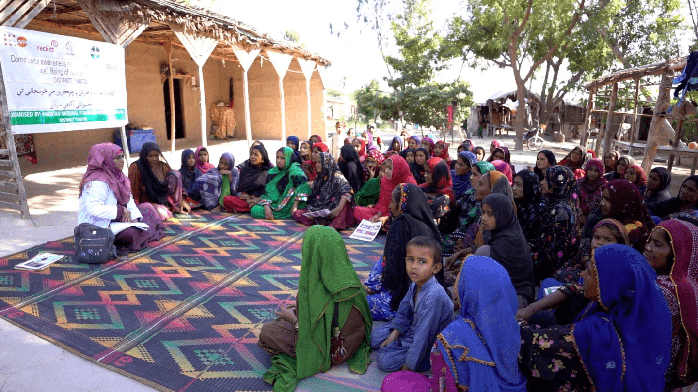 Community women in Thatta gather for an awareness session on hygiene and well-being, empowering them with knowledge to lead healthier and more informed lives.
