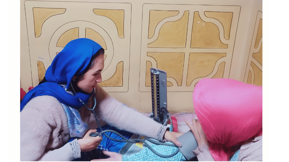 Fida Bibi, midwife from Yasin Valley, in Gligit Baltistan attending to a pregnant woman. 